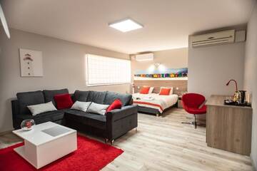 Фото номера Улучшенный четырехместный номер Апарт-отели Apartamenty ELITMAT г. Миньск-Мазовецки 4